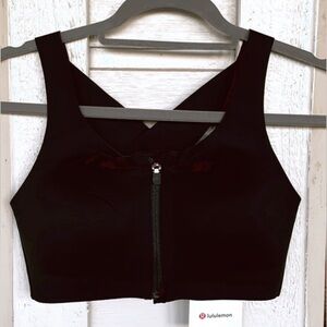 Lululemon black zip up sports bra criss cross back tags attached 34C